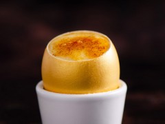 Crème Brûlée served in a golden egg shell Crème Brûlée served in a golden egg shell