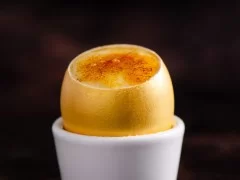 Crème Brûlée served in a golden egg shell