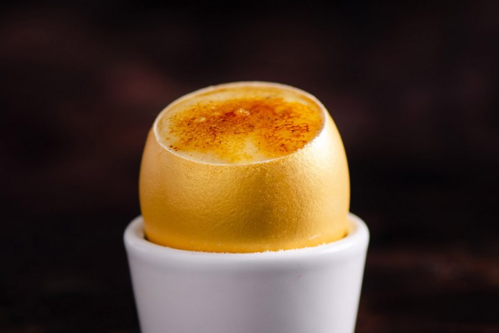 Crème Brûlée served in a golden egg shell