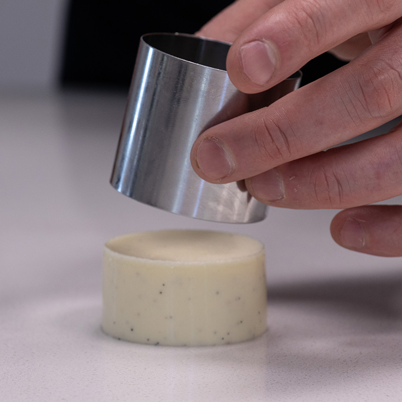 The Christmas Creme Brulee being removed from tart band mould