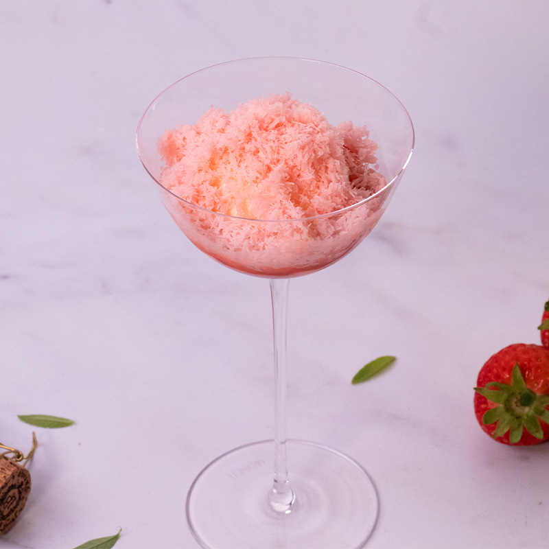 Glazed Strawberries with Lemon Verbena Cream & Champagne Snow finished Dessert Glazed Strawberries with Lemon Verbena Cream & Champagne Snow served in a Moner coupe glass