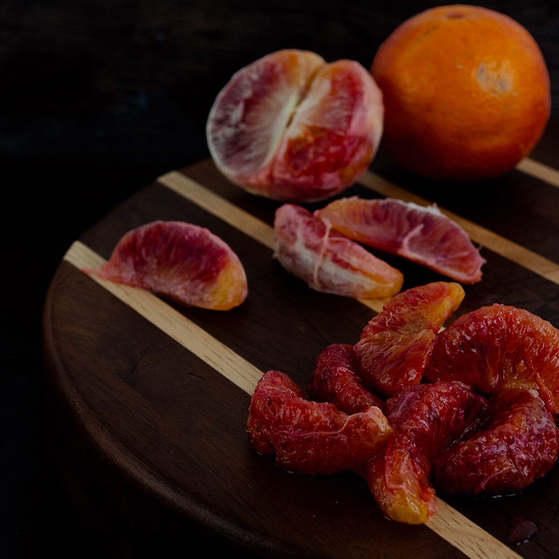This image shows an example of enzymatic peeling using pectinase on a blood orange.