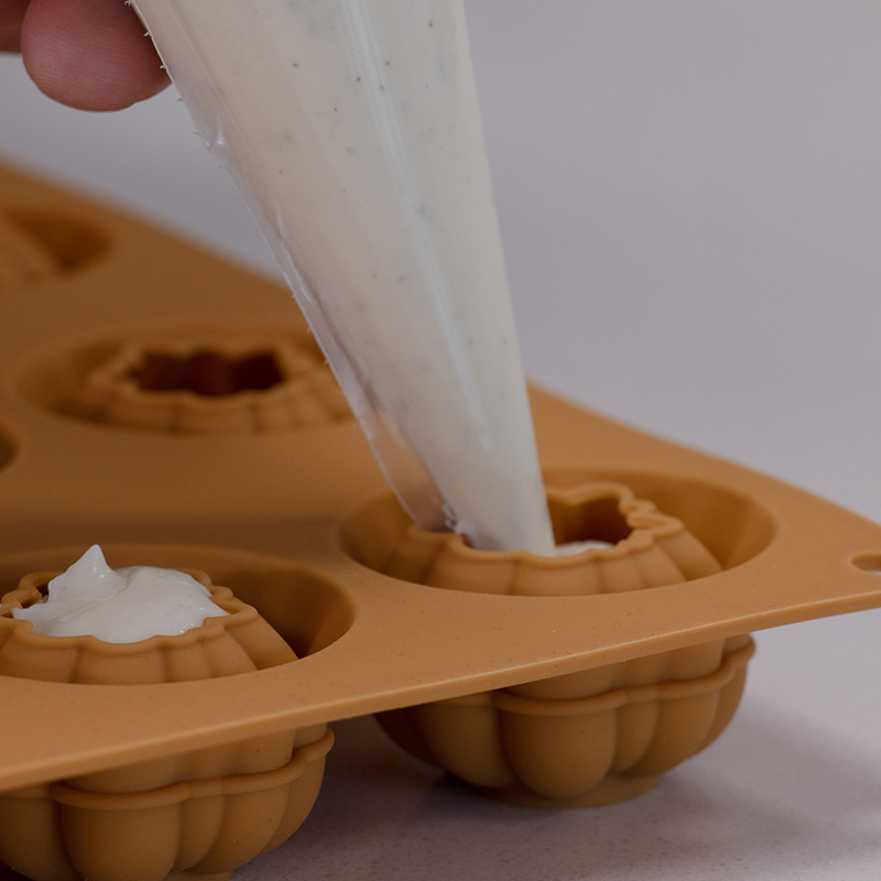 Savoury Goat's Cheese mousse being piped into a mould