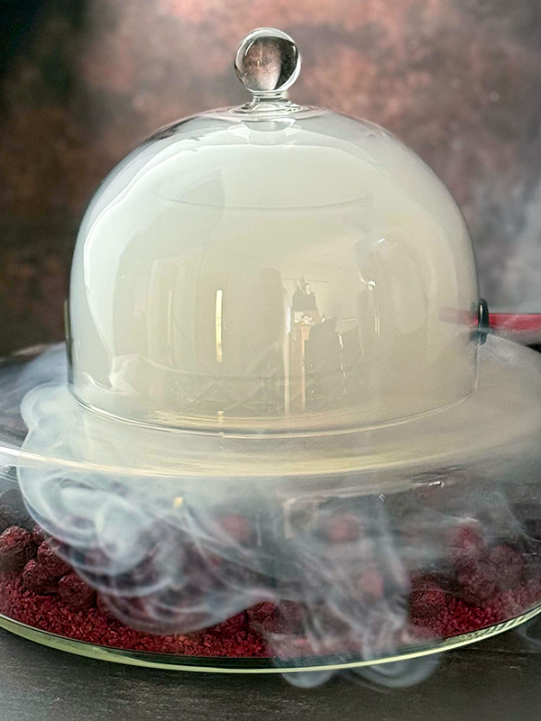 Smoking the Manhattan An image of a cocktail under a smoking cloche