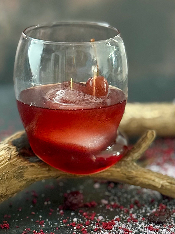 Peak smoked Manhattan Close up of a beautiful peak smoked Manhattan on a branch